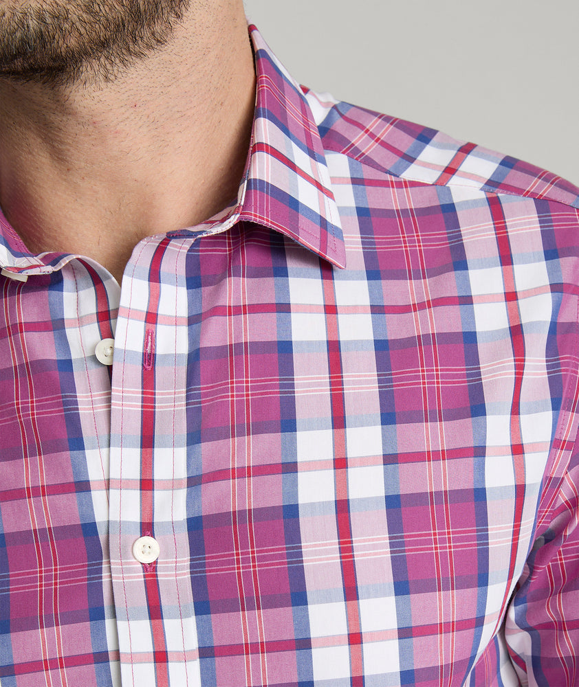 Model is wearing UNTUCKit rafferty shirt in plaid red. 