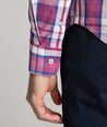 Model is wearing UNTUCKit rafferty shirt in plaid red. 