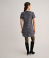 Model is wearing UNTUCKit Tweed Ravenna Shift Dress.