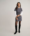 Model is wearing UNTUCKit Tweed Ravenna Shift Dress.