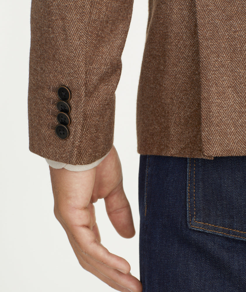 Model is wearing UNTUCKit Italian Wool Rawlins Sport Coat in Tan Herringbone.