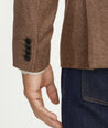 Model is wearing UNTUCKit Italian Wool Rawlins Sport Coat in Tan Herringbone.