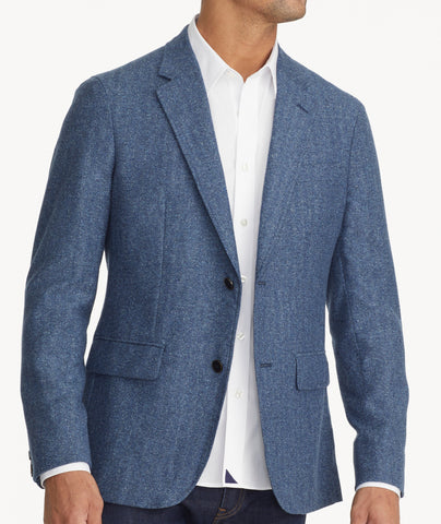 Model is wearing UNTUCKit Italian Wool Rawlins Sport Coat in Blue Herringbone. 