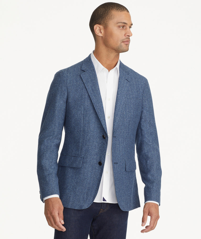 Model is wearing UNTUCKit Italian Wool Rawlins Sport Coat in Blue Herringbone.