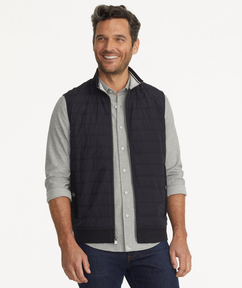 Model is wearing UNTUCKit Rebulo vest in black.