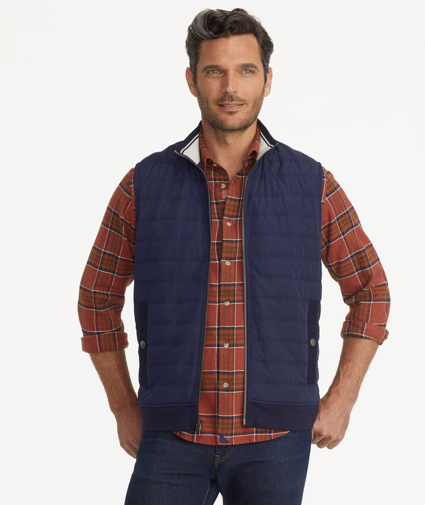 Model is wearing UNTUCKit Rebulo vest in navy.