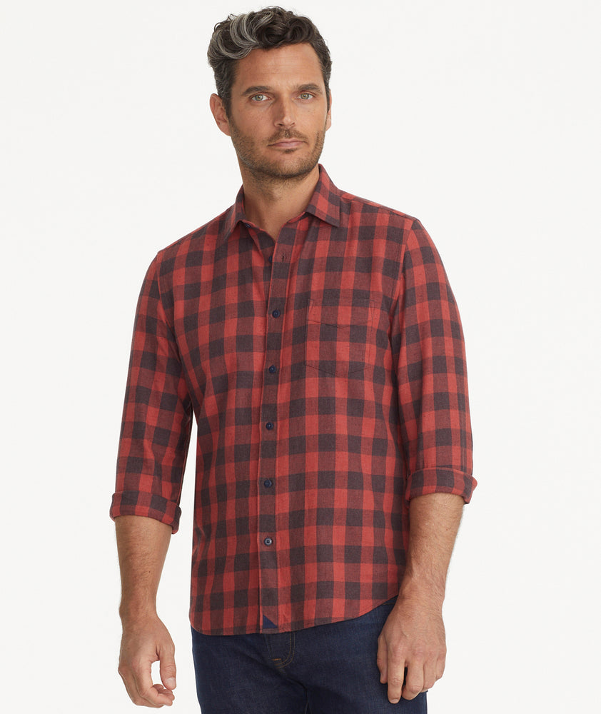 Model is wearing UNTUCKit red and burgundy buffalo check flannel.