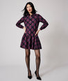 Model is wearing UNTUCKit Reese dress in purple plaid.