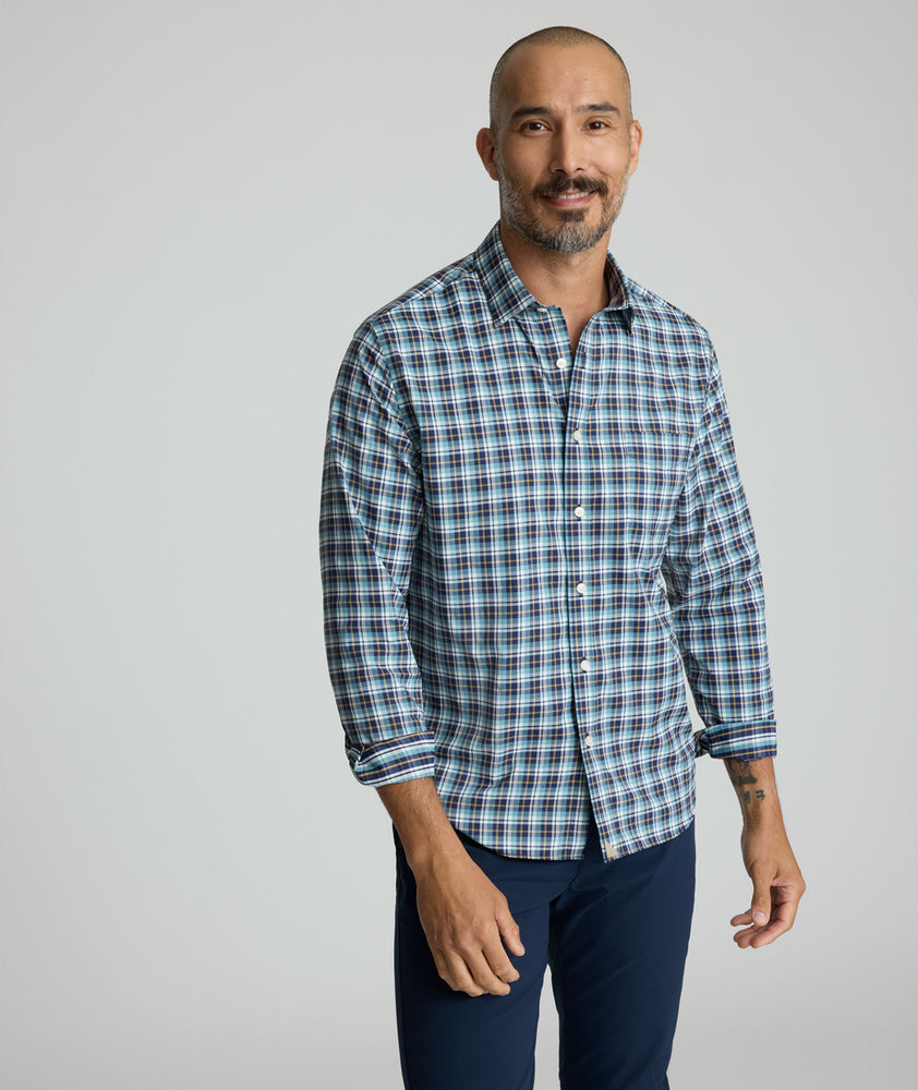 Model is wearing UNTUCKit Reiner performance shirt. 