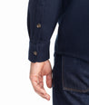 Model is wearing UNTUCKit Cotton-Linen Overshirt in Navy.