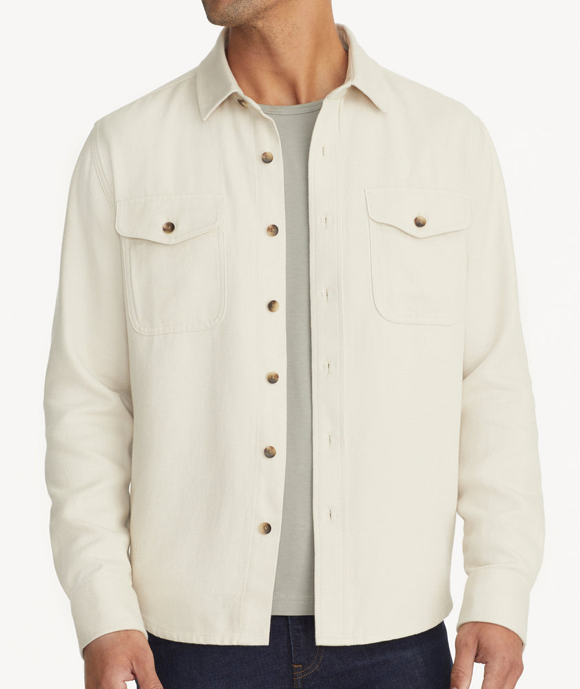Model is wearing UNTUCKit Cotton-Linen Overshirt in Off-White. 