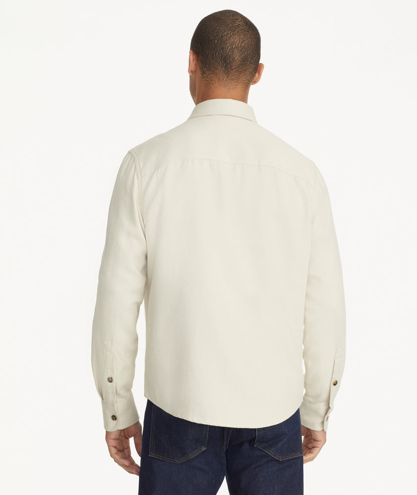 Model is wearing UNTUCKit Cotton-Linen Overshirt in Off-White.