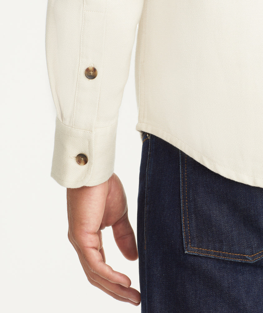 Model is wearing UNTUCKit Cotton-Linen Overshirt in Off-White.
