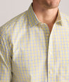 Model is wearing UNTUCKit Wrinkle-Free Ridgewell Shirt in yellow-check.