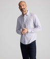 Model is wearing UNTUCKit Wrinkle-Free Ridgewell Shirt in blue-check.