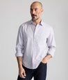 Model is wearing UNTUCKit Wrinkle-Free Ridgewell Shirt in blue-check.
