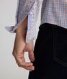 Model is wearing UNTUCKit Wrinkle-Free Ridgewell Shirt in blue-check.