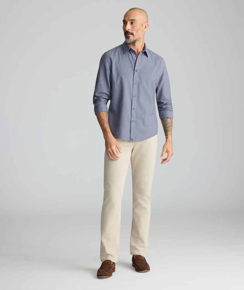 Model is wearing UNTUCKit 5-Pocket Stretch Terry Pants in London fog. 