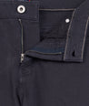 Model is wearing UNTUCKit 5-Pocket Stretch Terry Pants in Navy. 
