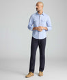 Model is wearing UNTUCKit 5-Pocket Stretch Terry Pants in Navy. 