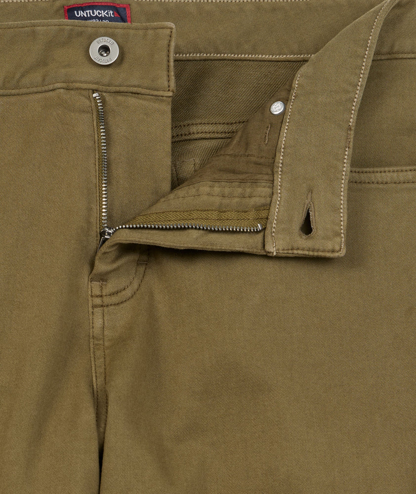 Model is wearing UNTUCKit 5-Pocket Stretch Terry Pants in Olive. 