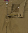 Model is wearing UNTUCKit 5-Pocket Stretch Terry Pants in Olive. 