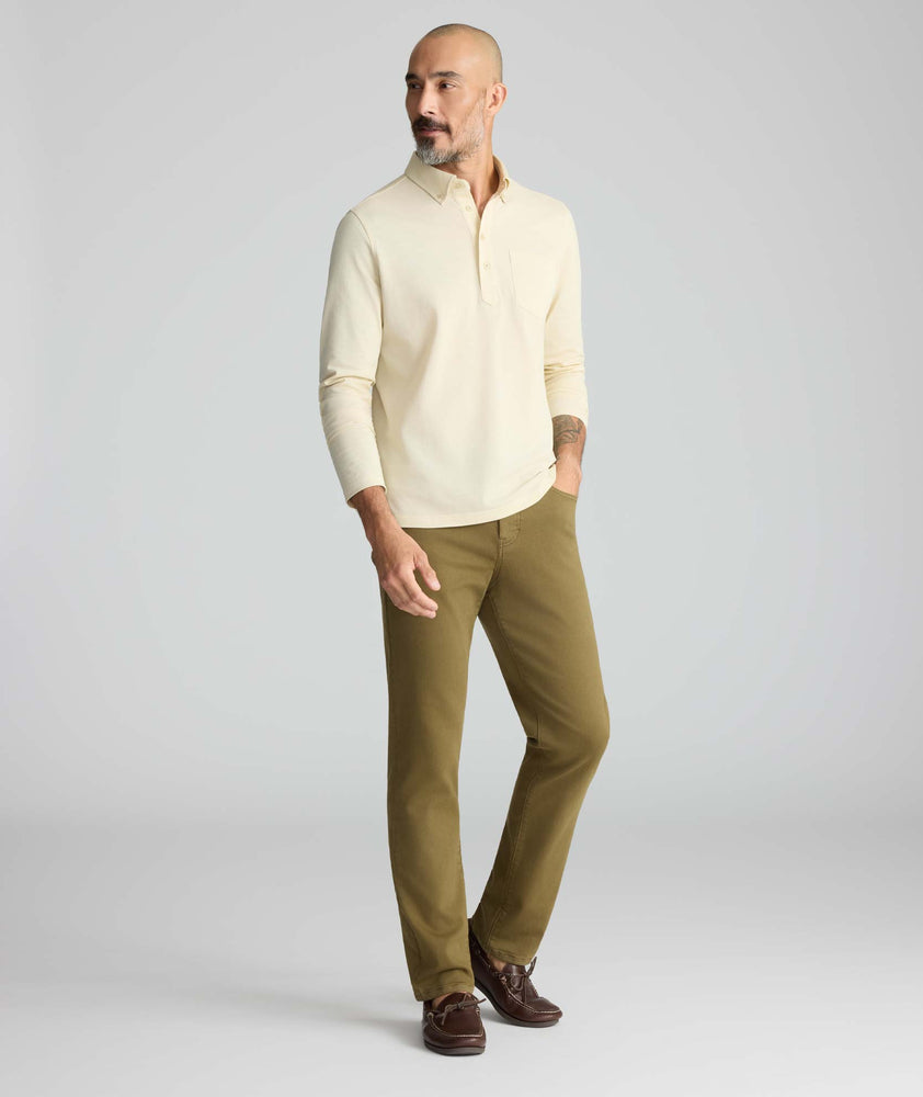 Model is wearing UNTUCKit 5-Pocket Stretch Terry Pants in Olive. 
