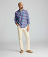 Model is wearing UNTUCKit 5-Pocket Stretch Terry Pants in stone. 