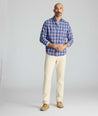 Model is wearing UNTUCKit 5-Pocket Stretch Terry Pants in stone. 
