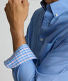 Model is wearing UNTUCKit Rosire wrinkle-free button down shirt. 