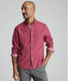 Model is wearing UNTUCKit Rosaire wrinkle-free shirt in Rhododenron.