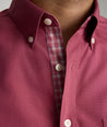 Model is wearing UNTUCKit Rosaire wrinkle-free shirt in Rhododenron.