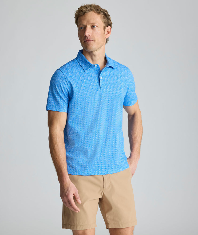 Model is wearing UNTUCKit CottonTek Polo in blue. 