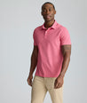 Model is wearing UNTUCKit Model is wearing UNTUCKit CottonTek Polo in Magenta Wine Bottle Print.