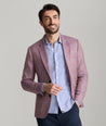 Model is wearing UNTUCKit Ross sports coat in red. 