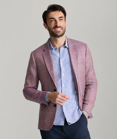 Model is wearing UNTUCKit Ross sports coat in red. 