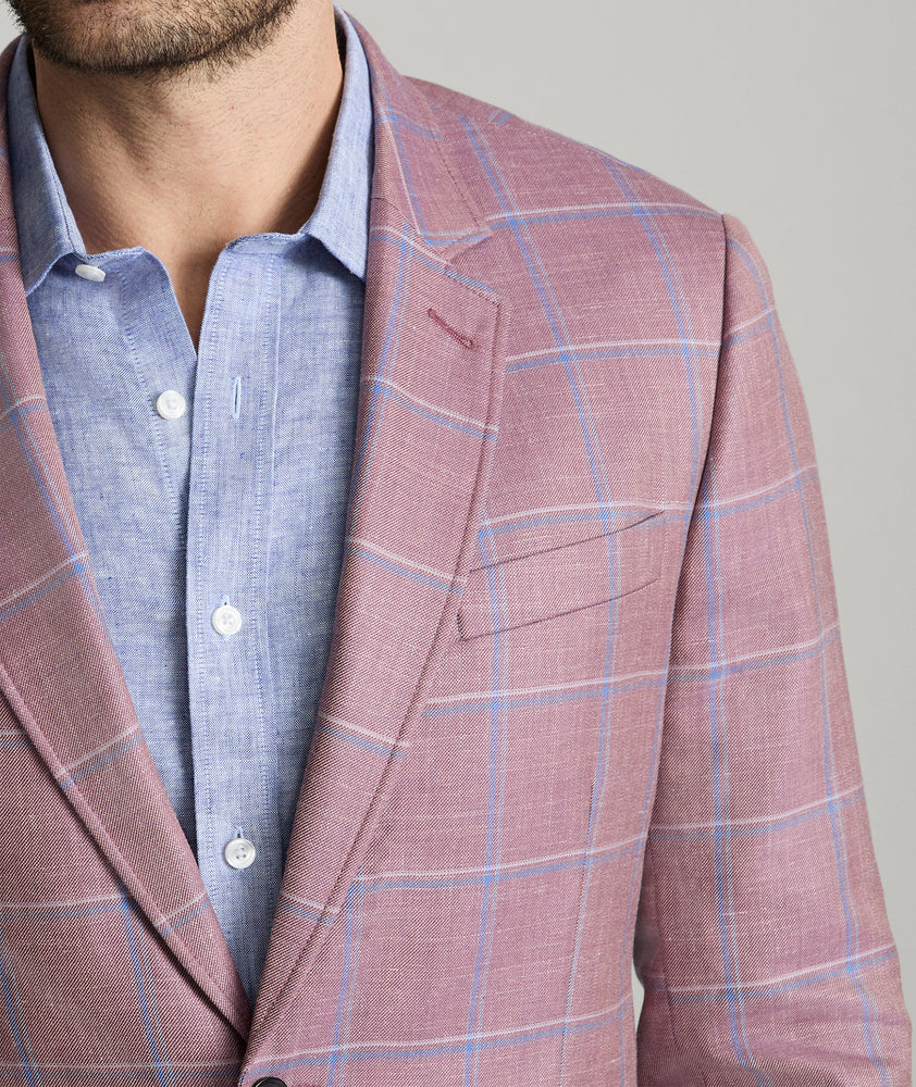 Model is wearing UNTUCKit Ross sports coat in red. 