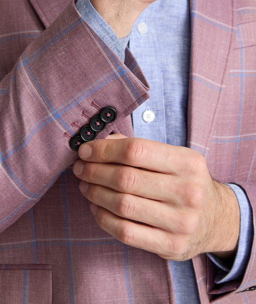 Model is wearing UNTUCKit Ross sports coat in red. 