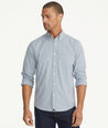 Model is wearing UNTUCKit Wrinkle-Free Performance Rowan Shirt in Blue & Navy Small Check.