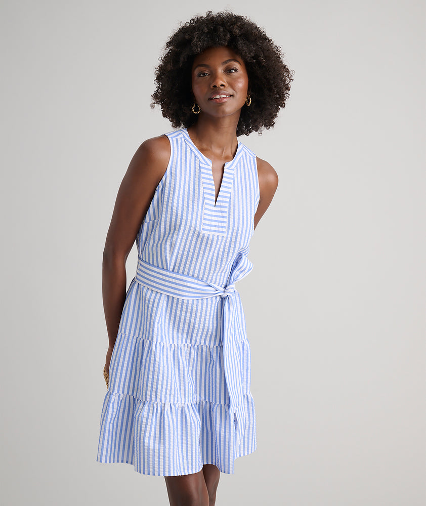 Model is wearing UNTUCKit Roxanne blue stripped dress. 