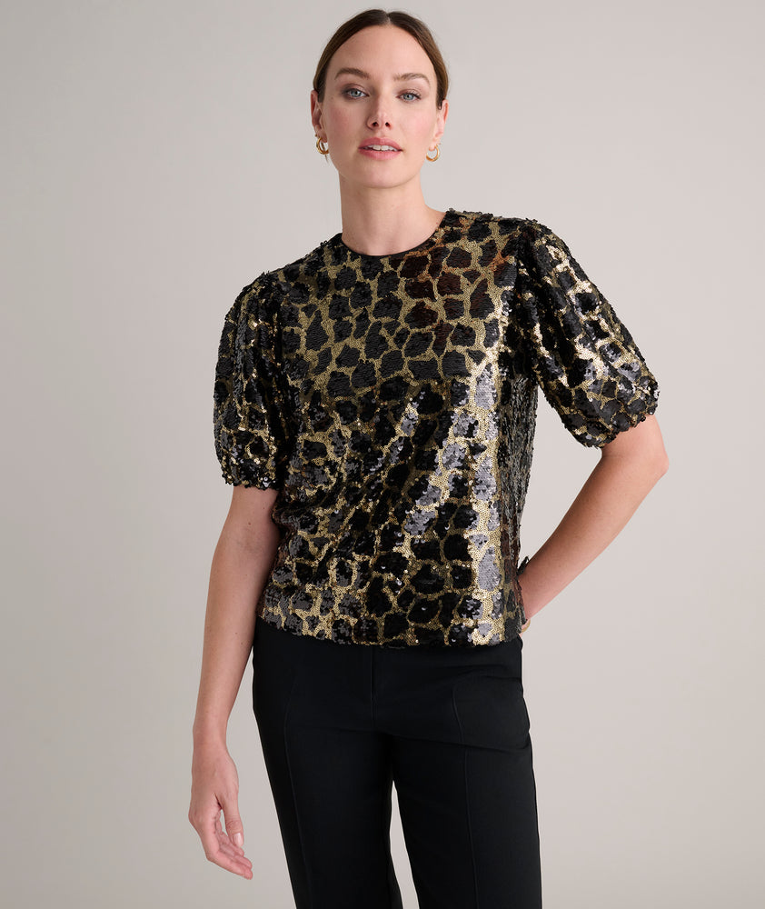 Model is wearing UNTUCKit roxie sequin top. 