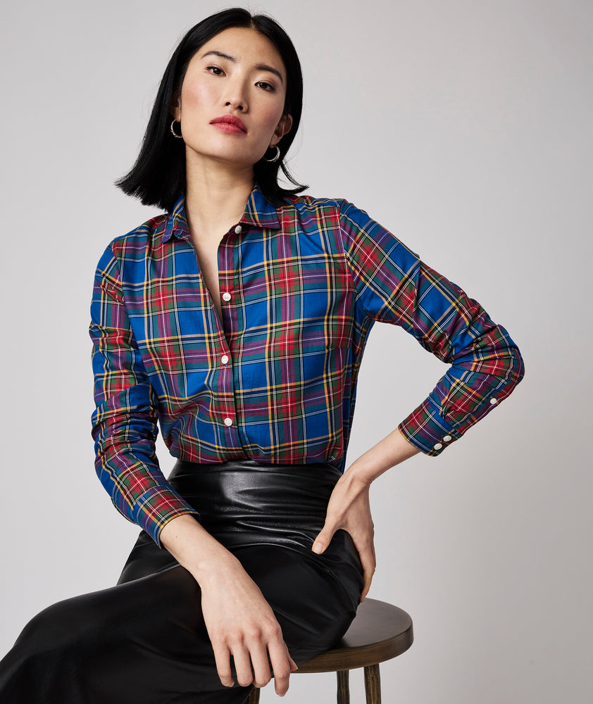 Model is wearing UNTUCKit Sadie shirt in blue plaid. 