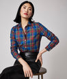 Model is wearing UNTUCKit Sadie shirt in blue plaid. 