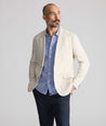 Model is wearing UNTUCKit Linen-Cotton Sagefield Sport Coat in Tan.