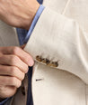 Model is wearing UNTUCKit Linen-Cotton Sagefield Sport Coat in Tan.