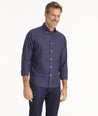Model is wearing UNTUCKit Wrinkle-Free Salamino Shirt in Dark Blue Check.