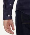Model is wearing UNTUCKit Wrinkle-Free Salamino Shirt in Dark Blue Check.