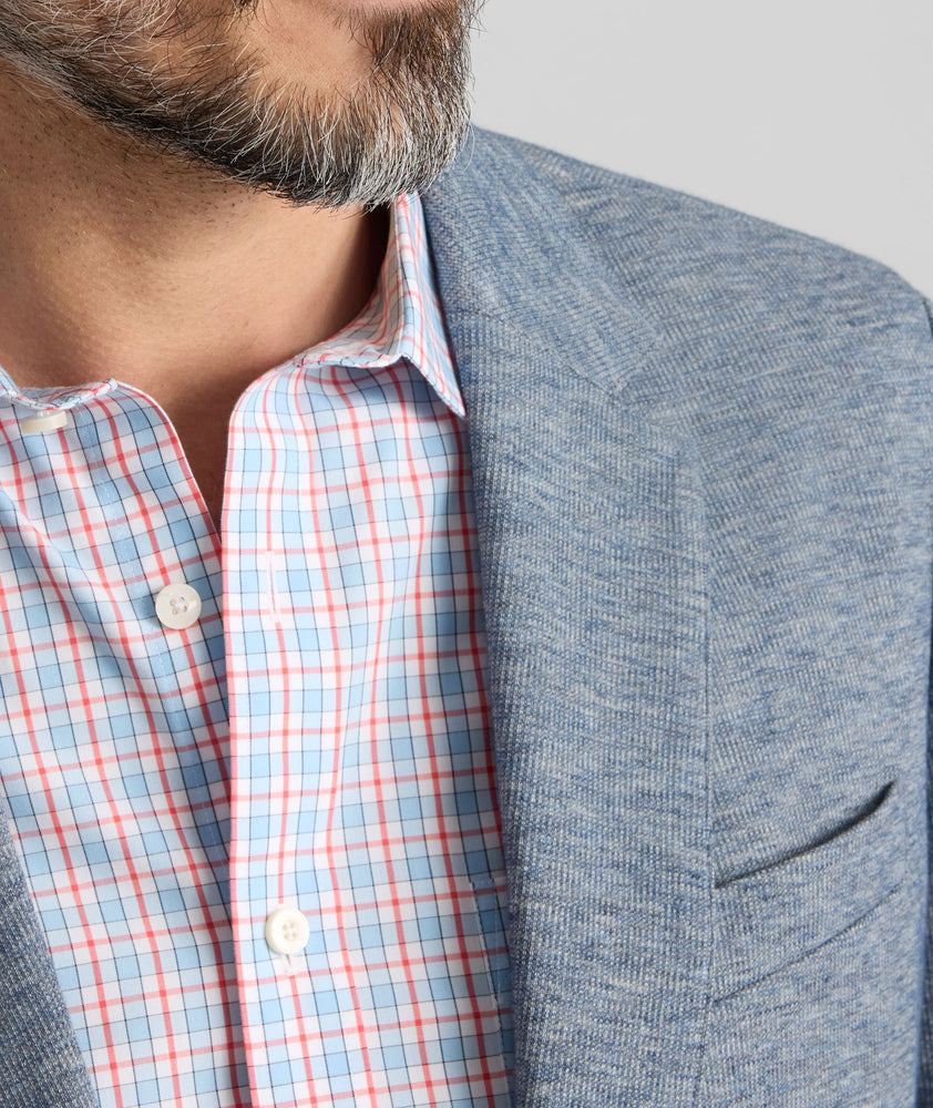 Model is wearing UNTUCKit Cotton-Blend Knit San Oro Sport Coat in Blue. 