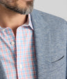 Model is wearing UNTUCKit Cotton-Blend Knit San Oro Sport Coat in Blue. 
