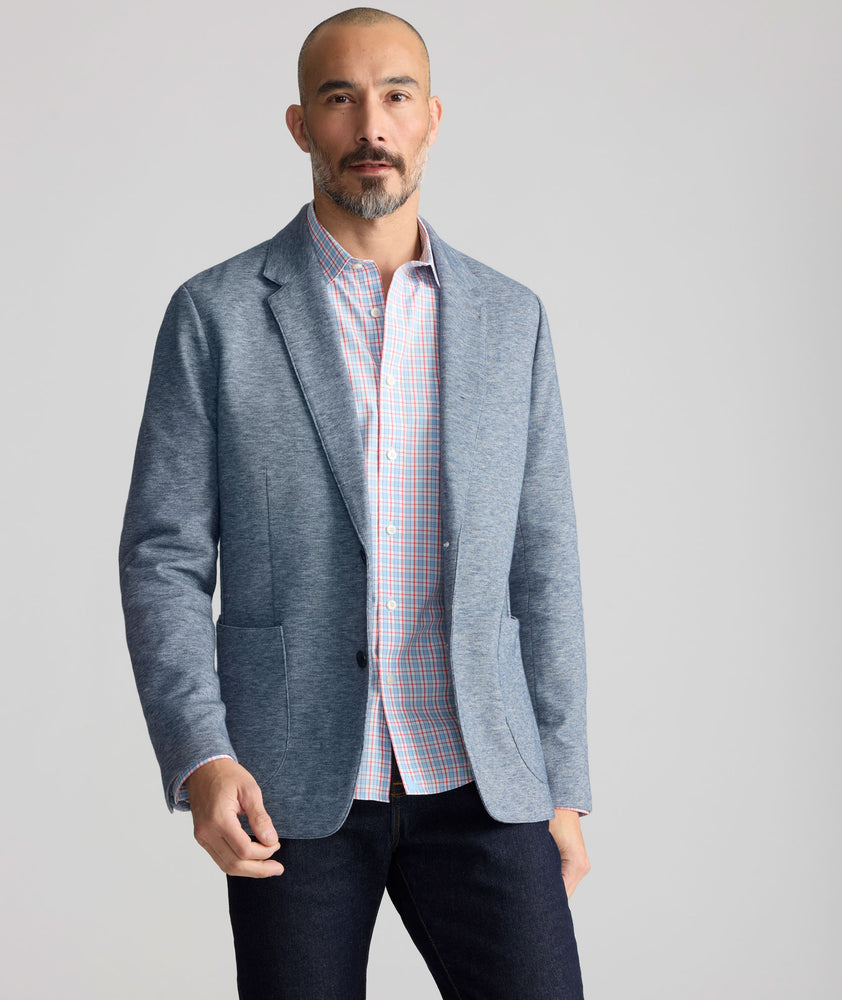 Model is wearing UNTUCKit Cotton-Blend Knit San Oro Sport Coat in Blue. 